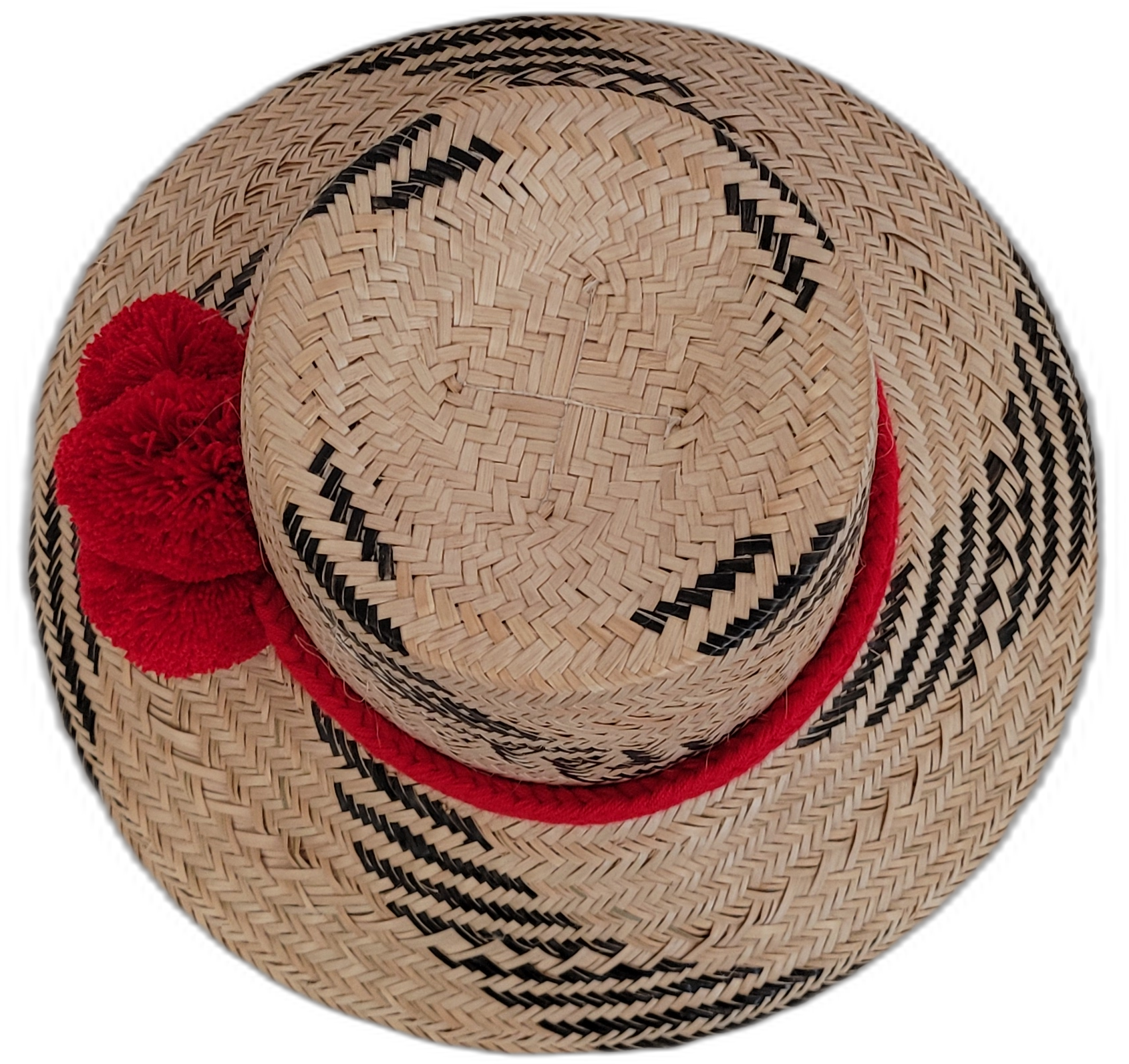 Black and natural Wayuu handmade straw hat with eye-catching red pompoms.

