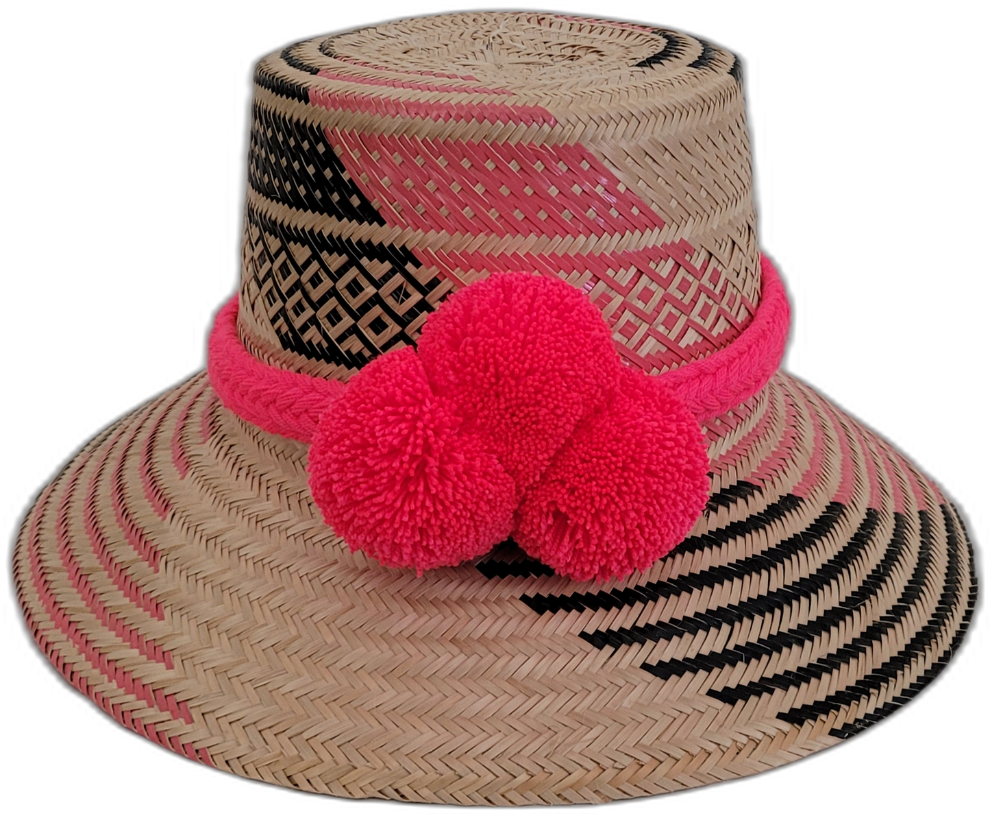 Handmade Wayuu straw hat with bold pink and black patterns, featuring large pink pompoms, perfect bohemian chic style.