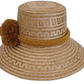 Boho Wayuu hat crafted from natural straw and decorated with ochre pompoms.

