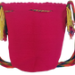 Colorful and crochet pink Wayuu mochila bag featuring double tassels and a bold Boho-chic strap.