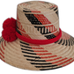 Bohemian Wayuu hat, handwoven with black and red patterns, featuring red pompoms.


