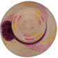 Boho Chic hat, Wayuu artisan-made, straw hat with vibrant pink, yellow, and purple designs, adorned with pompoms.