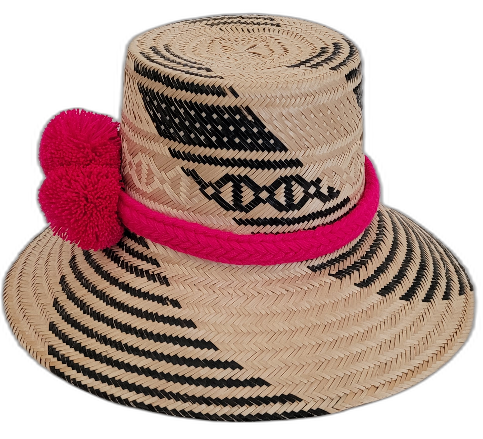 Boho Wayuu artisan straw hat in black and natural tones with bold pink pompoms.

