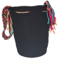 Artisan-crafted bohemian crochet bag with black body and bold multicolored accents. Lightweight, vegan, and culturally meaningful.