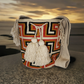 Large boho chick crochet bag with beige, black, and rust tones, artisan crossbody strap, striking geometric design, and oversized tassels.