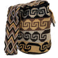 Large boho chick crochet bag with black, beige, and brown tones, artisan crossbody strap, and striking oversized tassels.