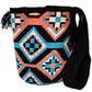 Large boho chick crochet bag with black, coral, turquoise tones, artisan crossbody strap, striking geometric design, and oversized tassels.