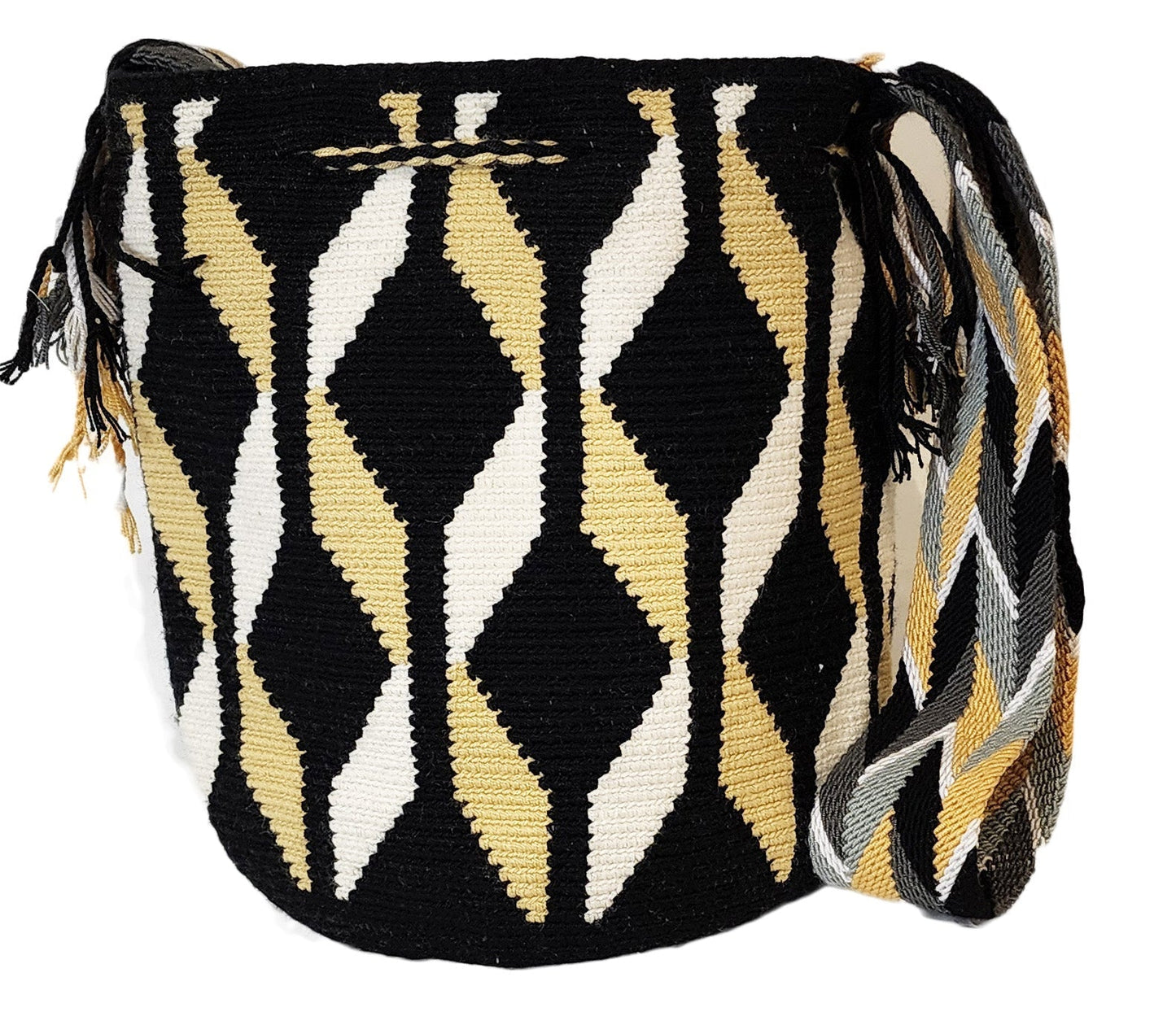 Large boho chick crochet bag in black, tan, and white, artisan crossbody strap, bold geometric wave pattern, and striking tassel accents.
