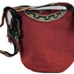 Large boho chick crochet bag in coral with floral lid, artisan crossbody strap, functional closure, and playful multicolor tassels.