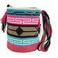 Large boho chick crochet bag with vivid pink and turquoise tones, artisan crossbody strap, and striking multicolor tassels.