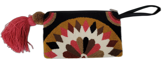 Boho chick clutch featuring artisan embroidery and wristlet handle



