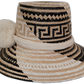 Boho chic straw hat named Elisa featuring white pompoms and Wayuu artisan craftsmanship

