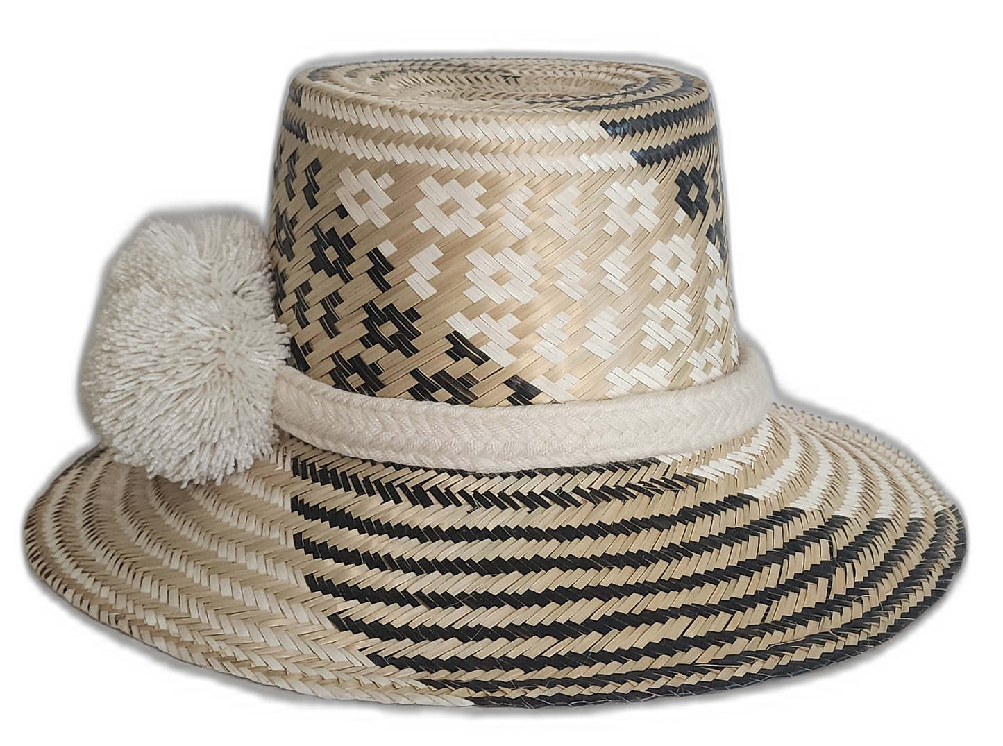 Black and beige bohemian straw hat with bold artisan detail and culturally significant white pompoms.