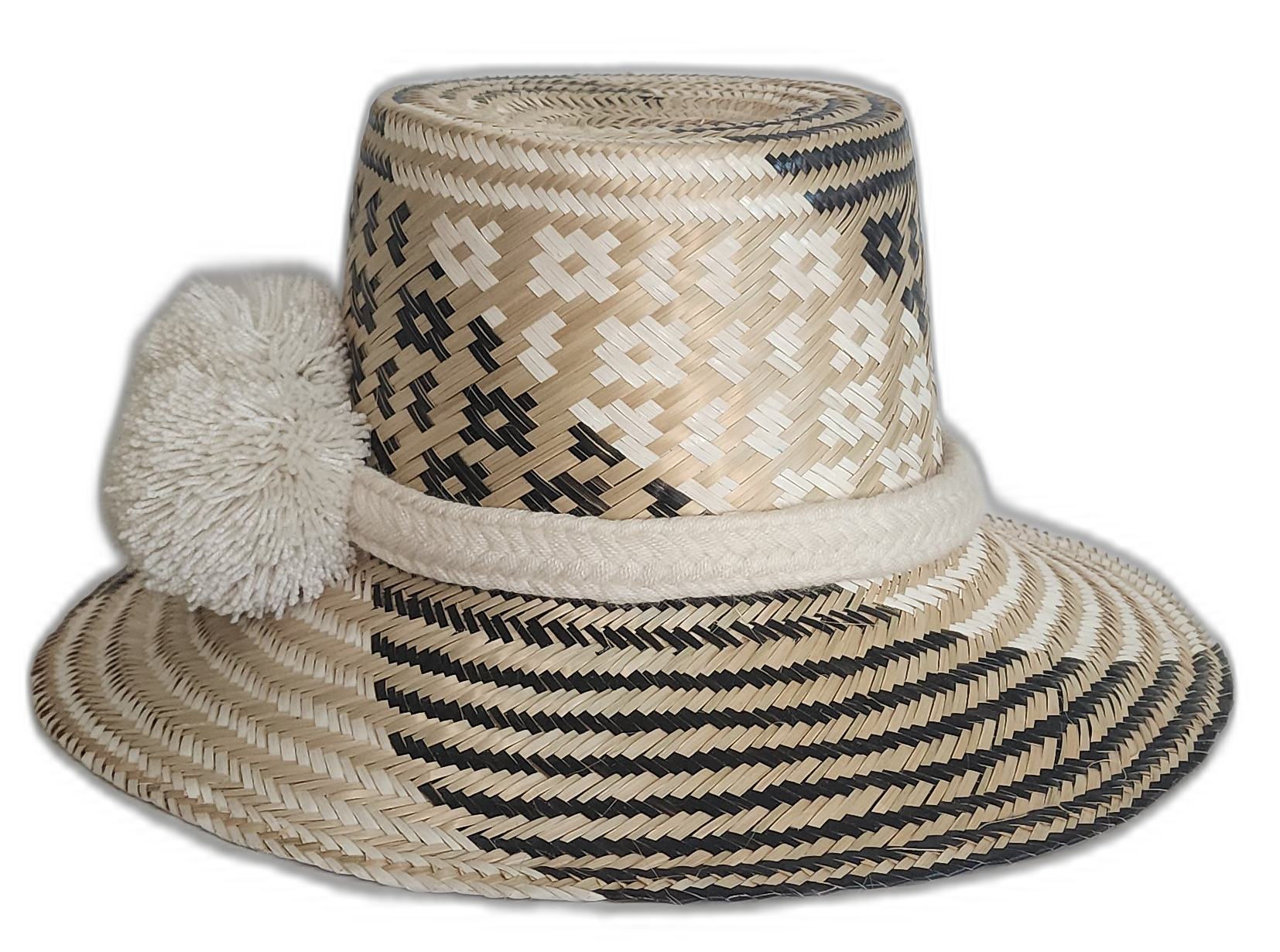 Black and beige bohemian straw hat with bold artisan detail and culturally significant white pompoms.