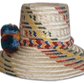 Boho chick straw hat with artisan earth-tone patterns and braided band, featuring colorful pompoms.

