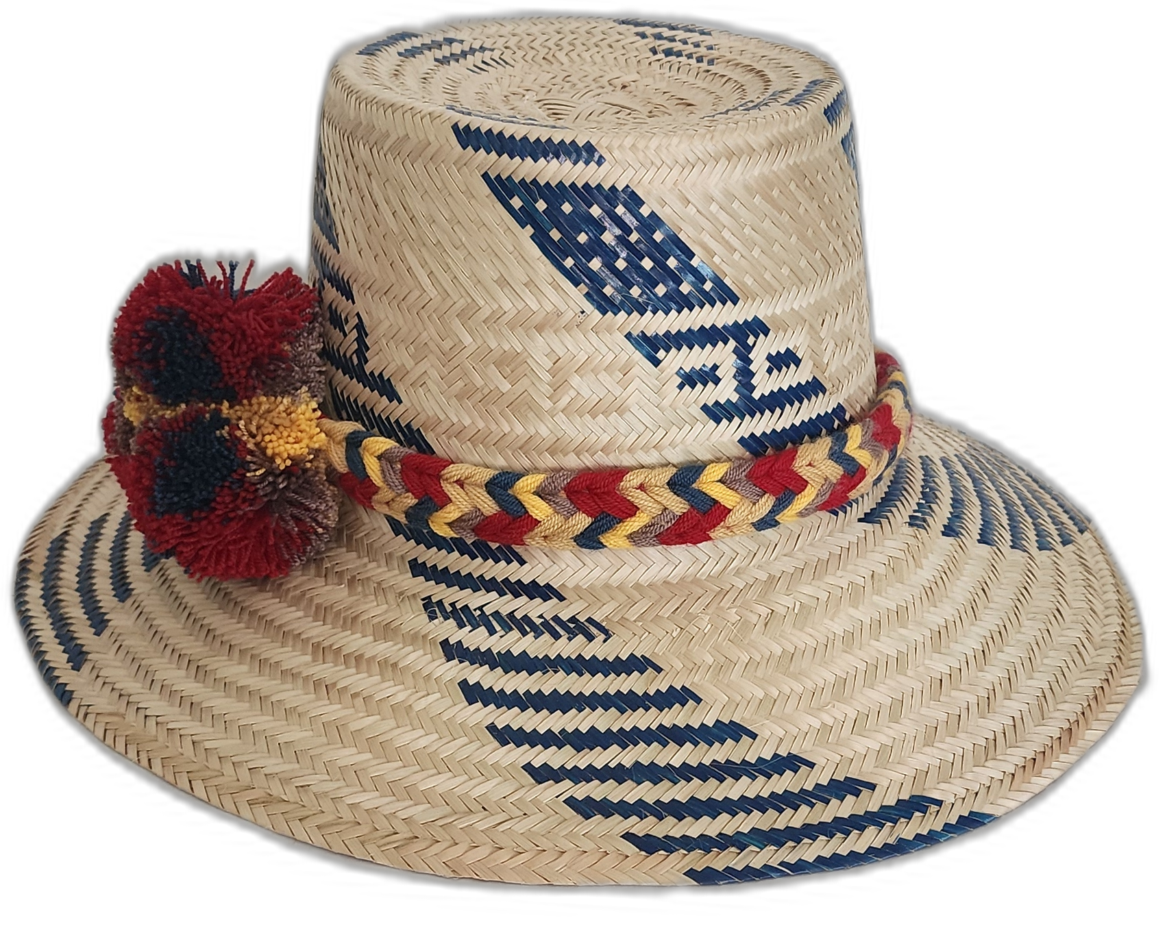 Boho straw hat featuring red, yellow, and navy pompoms woven by artisans