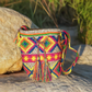 Colorful Wayuu crochet bag with a multicolor strap and diamond motif design.