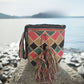 Handmade boho chick Wayuu bag with diamond pattern in red, green, and beige