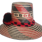 Boho chick straw hat with bold red and black pompoms.Bohemian straw hat with red-black stripe design and braided crown band

