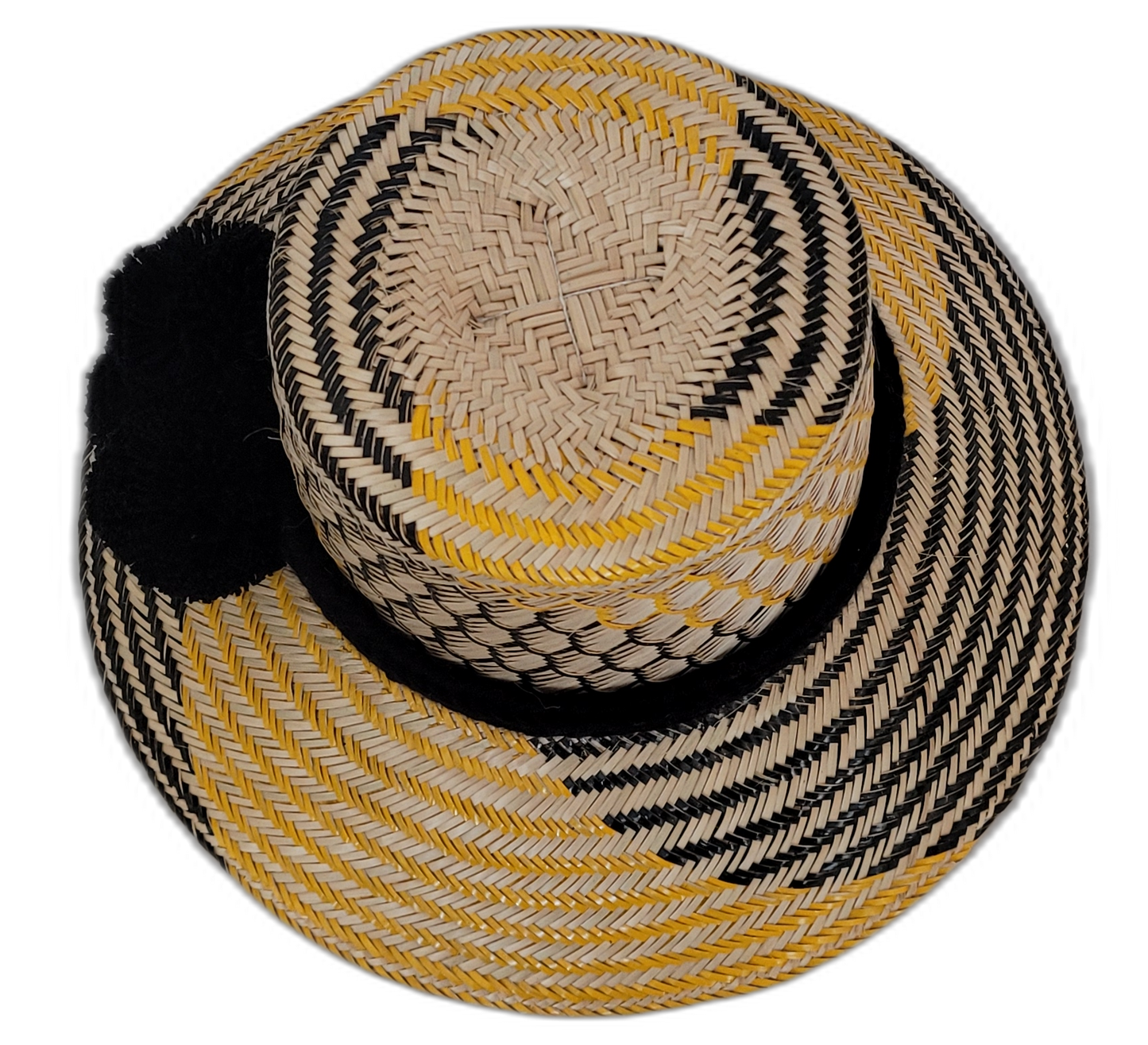 Black and yellow Wayuu hat with cultural pompoms and bold contrast
