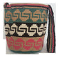 Bohemian Wayuu crossbody bag with bold tassels, adjustable strap, and vibrant cultural patterns.