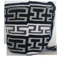 Handmade Wayuu bag in black and ivory, showcasing bohemian flair and artisanal detail.