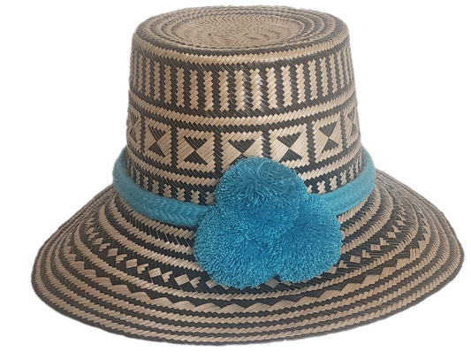 Handmade boho straw hat with turquoise pompoms and bold geometric weave