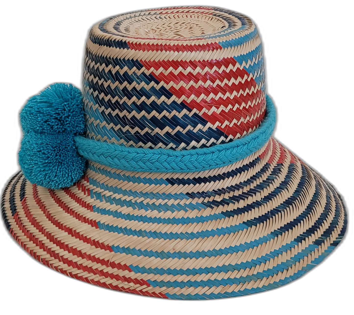 Handmade Wayuu boho straw hat with vibrant, colorful woven designs and blue pom-pom accents.

