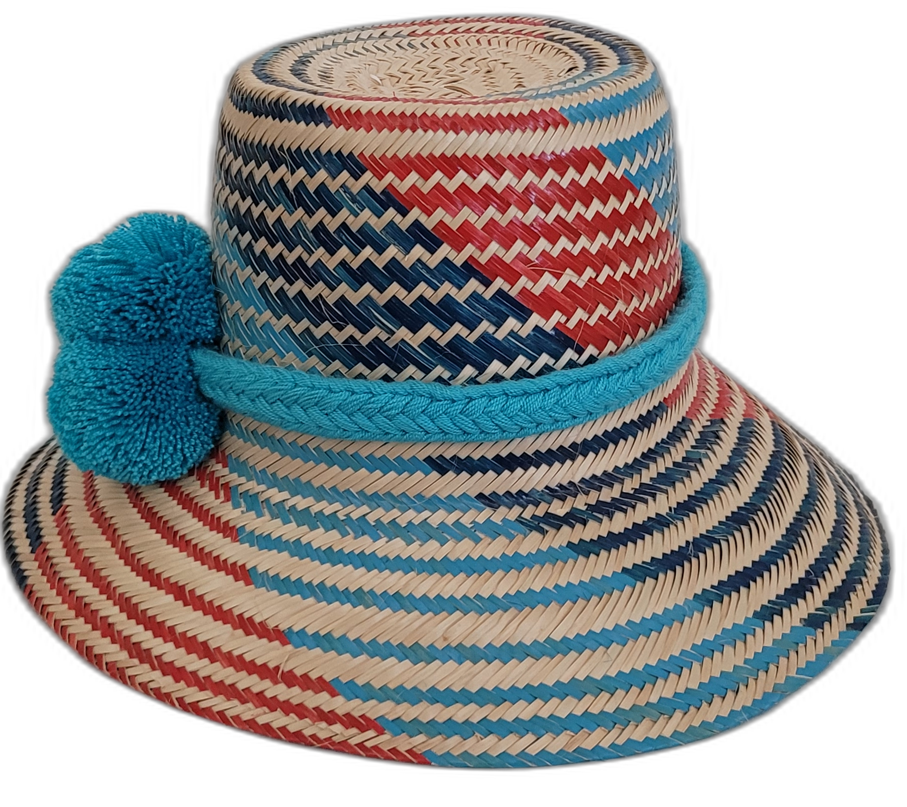 Handmade Wayuu boho straw hat with vibrant, colorful woven designs and blue pom-pom accents.

