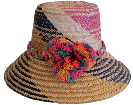 Colorful Wayuu straw hat with multicolor pompom and artisan woven detail.