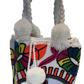 Boho-chic Wayuu bag featuring colorful embroidered eye and petals