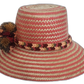 Bohemian Wayuu Hat crafted from Iraca palm, showcasing vibrant colors and cultural pompoms.