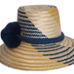 Artisan straw hat featuring yellow and blue weave with dark blue trim