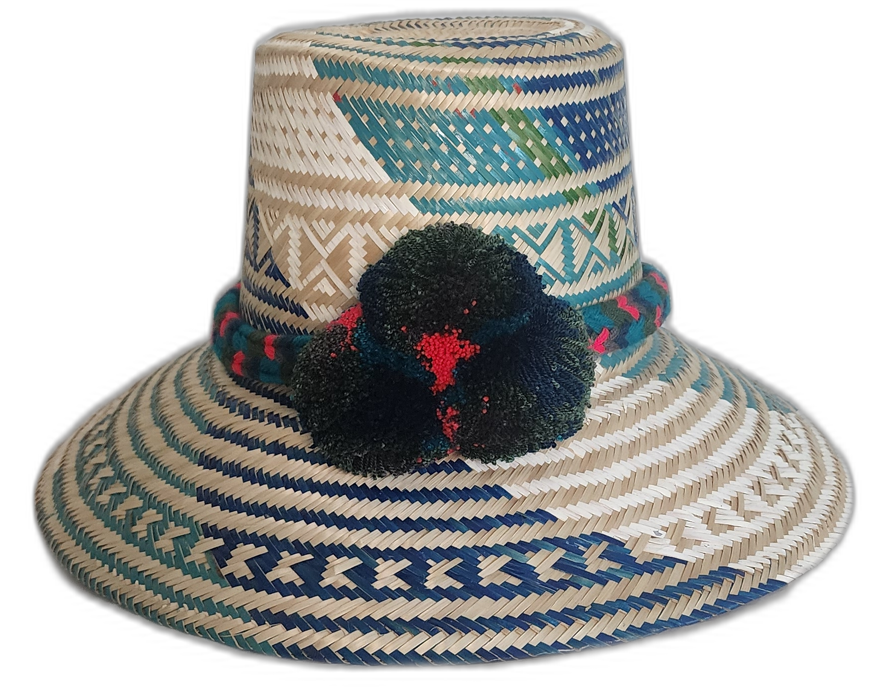 Boho straw hat handmade by Wayuu artisans, featuring blue and green woven designs with red-accented pompoms.