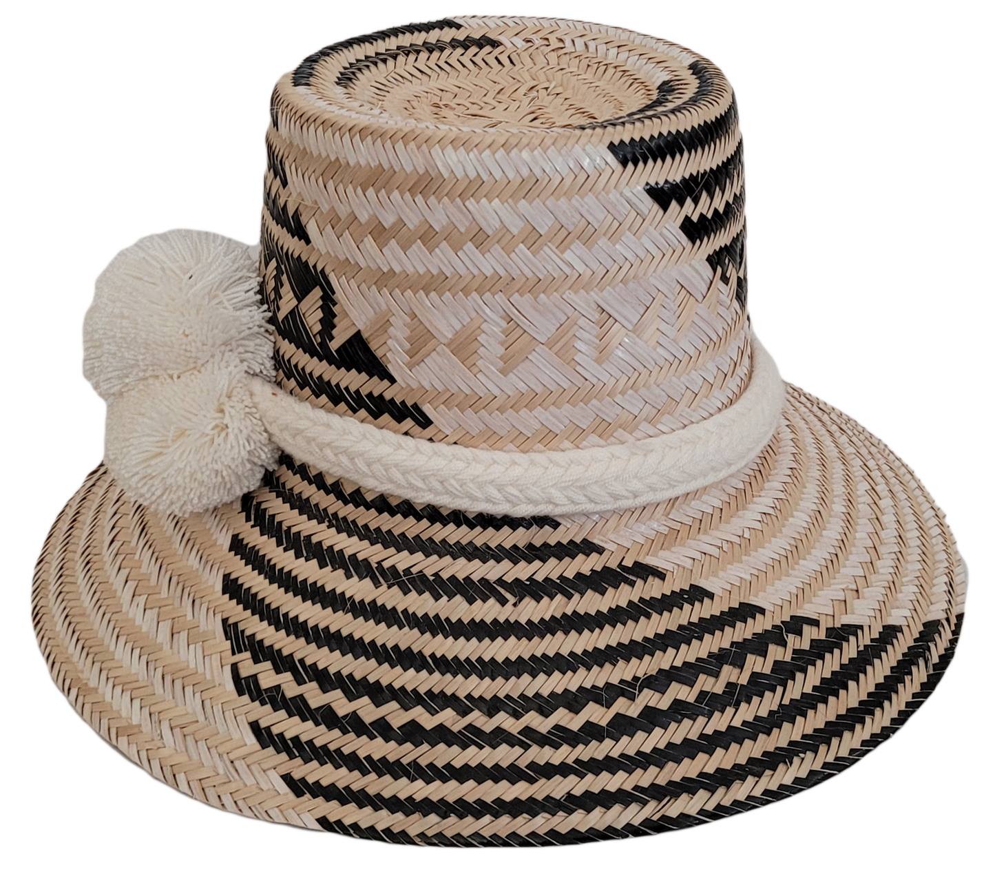 Colorful Boho straw hat, crafted from Iraca palm, featuring cream pompoms and black-beige weave.


