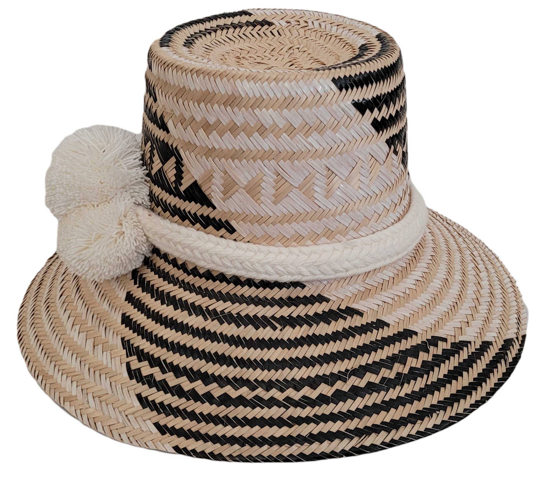 Colorful Boho straw hat, crafted from Iraca palm, featuring cream pompoms and black-beige weave.

