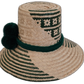 Colorful Boho straw hat, crafted from Iraca palm, featuring green and beige weave with handmade pompoms.