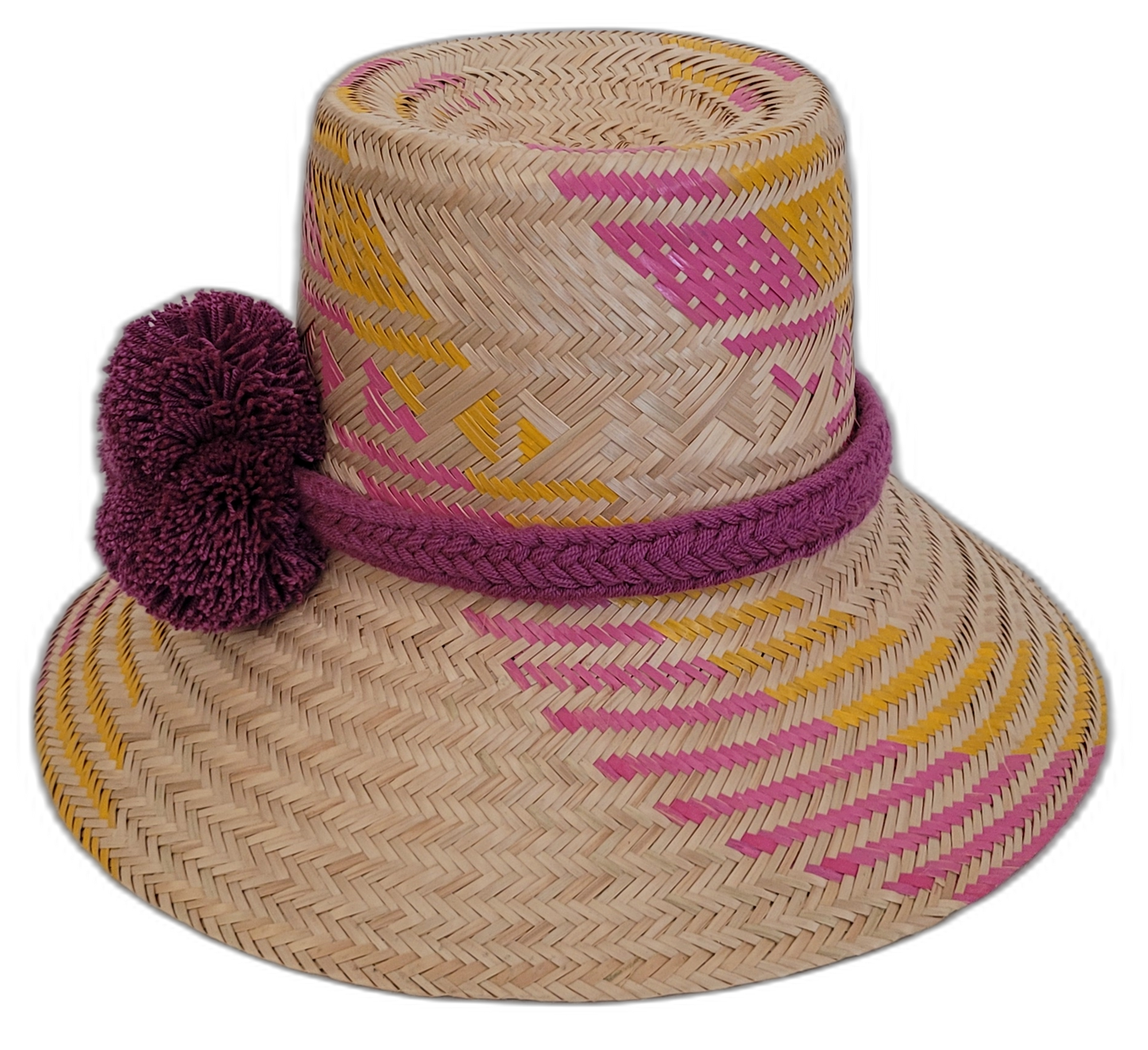 Colorful Boho straw hat, crafted from Iraca palm, featuring pink, yellow, and purple weave and handmade pompoms.