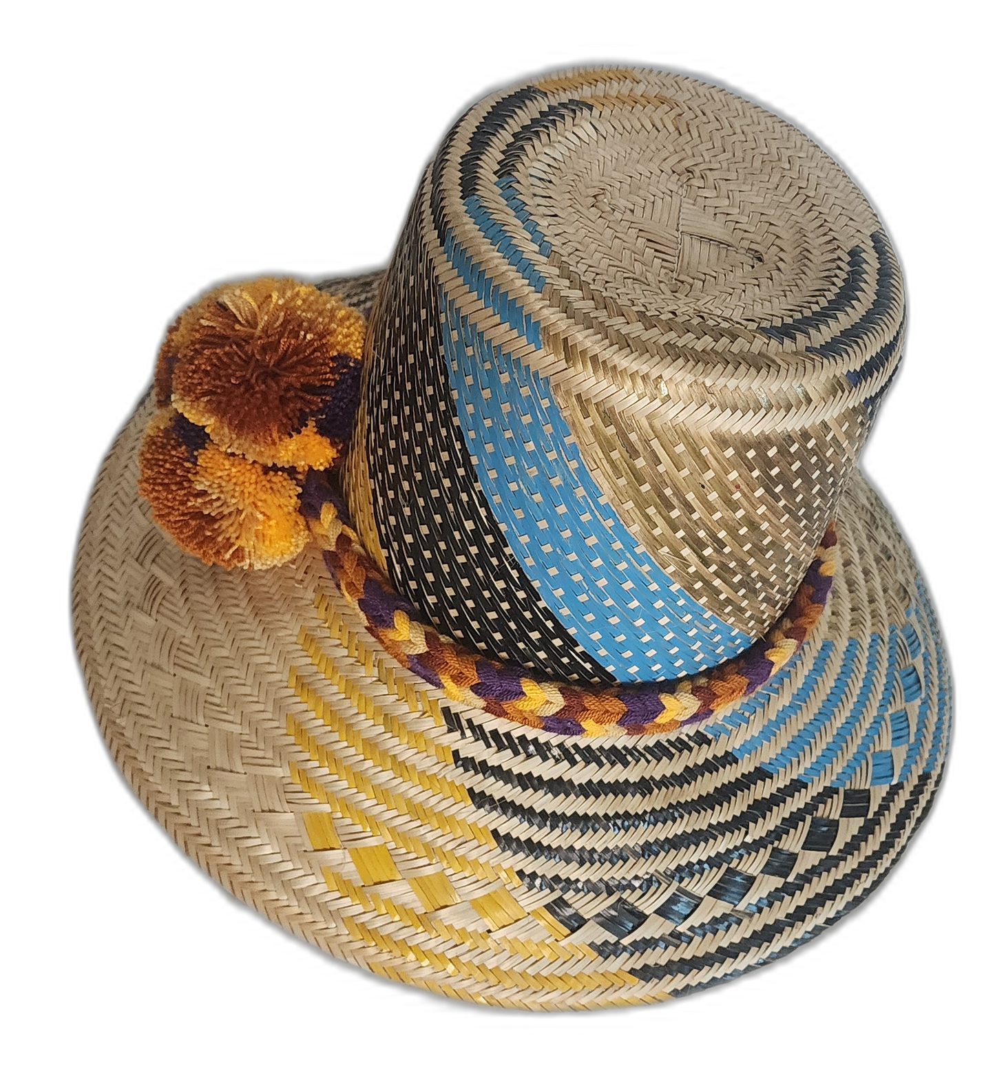 Bohemian straw hat with vibrant accents, handmade from natural materials by indigenous Wayuu artisans.
