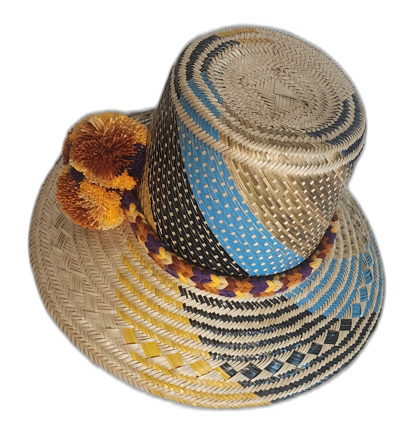 Bohemian straw hat with vibrant accents, handmade from natural materials by indigenous Wayuu artisans.