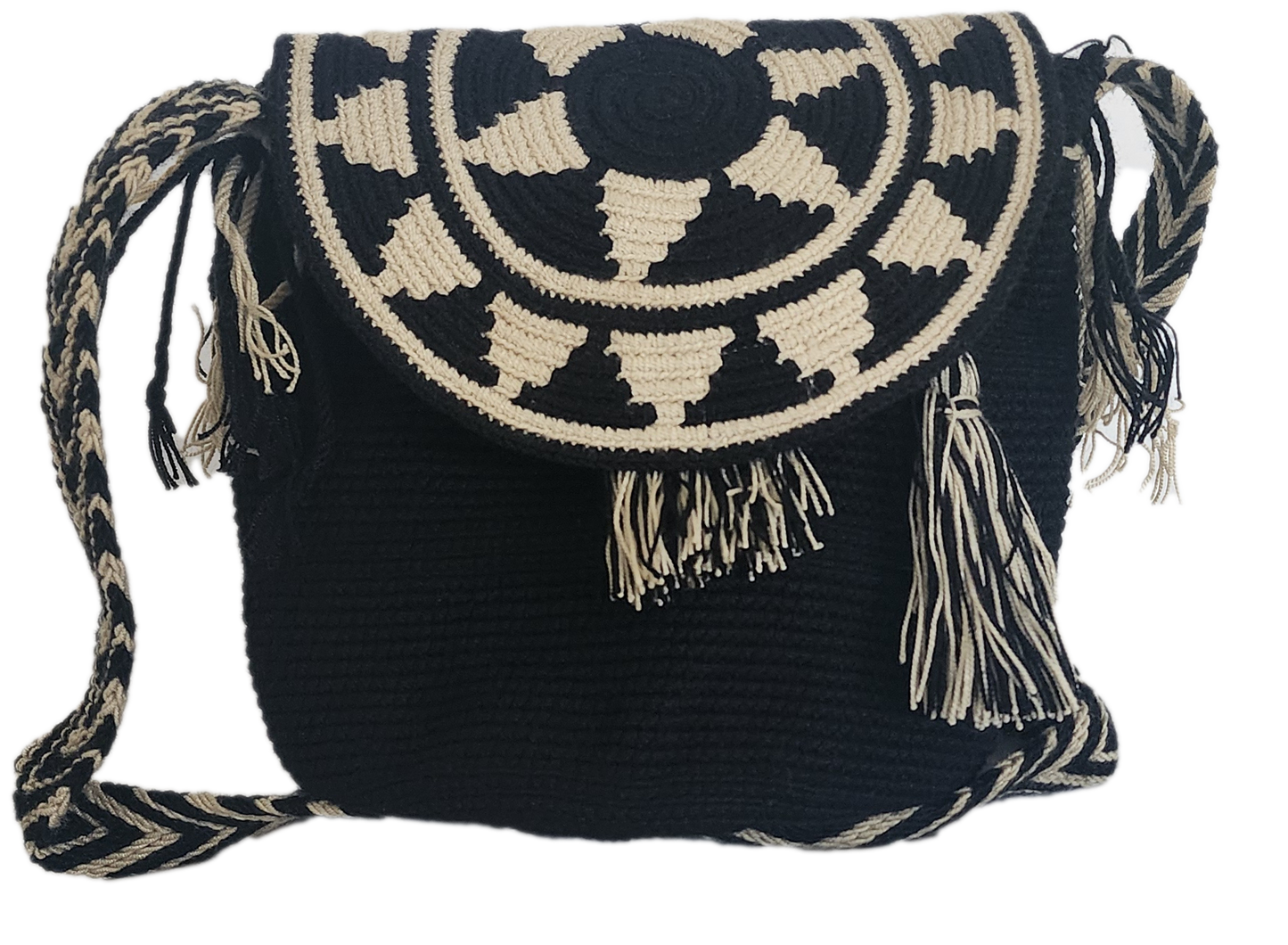 Handmade Wayuu crochet flap bag in black and beige with geometric tribal sunburst design and tassels — a bold artisan boho-chic essential.