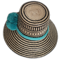 Boho Wayuu hat with geometric black weave and vibrant blue-green accents