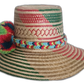 Natural Iraca palm hat with colorful design and red, blue, and green pompoms in boho colors

