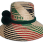 Natural palm Boho hat featuring red and green pattern with dark green trim.Bohemian straw hat with forest green braided band and deep green pompom trio

