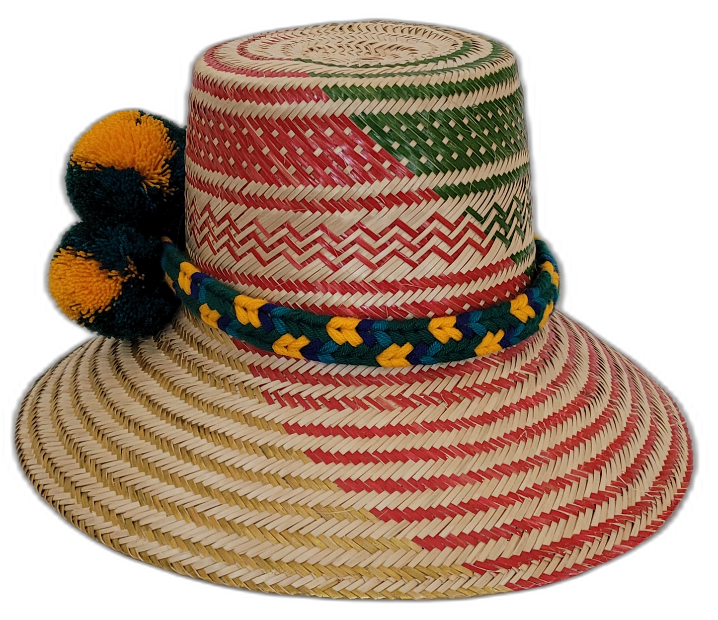 Boho chick straw hat featuring bold yellow and green pompom accents.Artisan Wayuu hat featuring geometric pattern and bright fluffy pompoms

