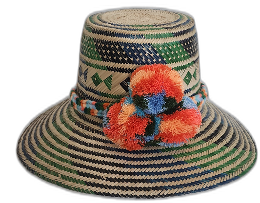 Handmade Wayuu straw hat with green, blue geometric pattern and orange pompoms.Bohemian straw hat with bright pompoms and tribal diamond designs


