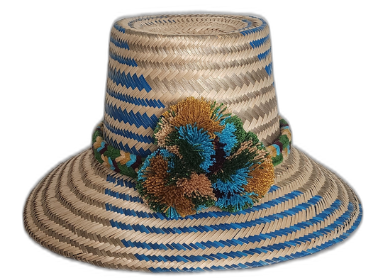 Handmade Wayuu straw hat with blue and earth-toned pompoms