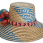 Boho hat with Iraca palm weave and pompoms in orange, blue, red, and yellow
