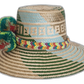 Boho hat featuring tribal weave and rainbow-colored artisan pompoms