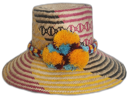 Handmade Wayuu straw hat with yellow, blue, and maroon pompoms